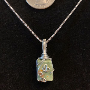 Silver wrapped cutie with charm